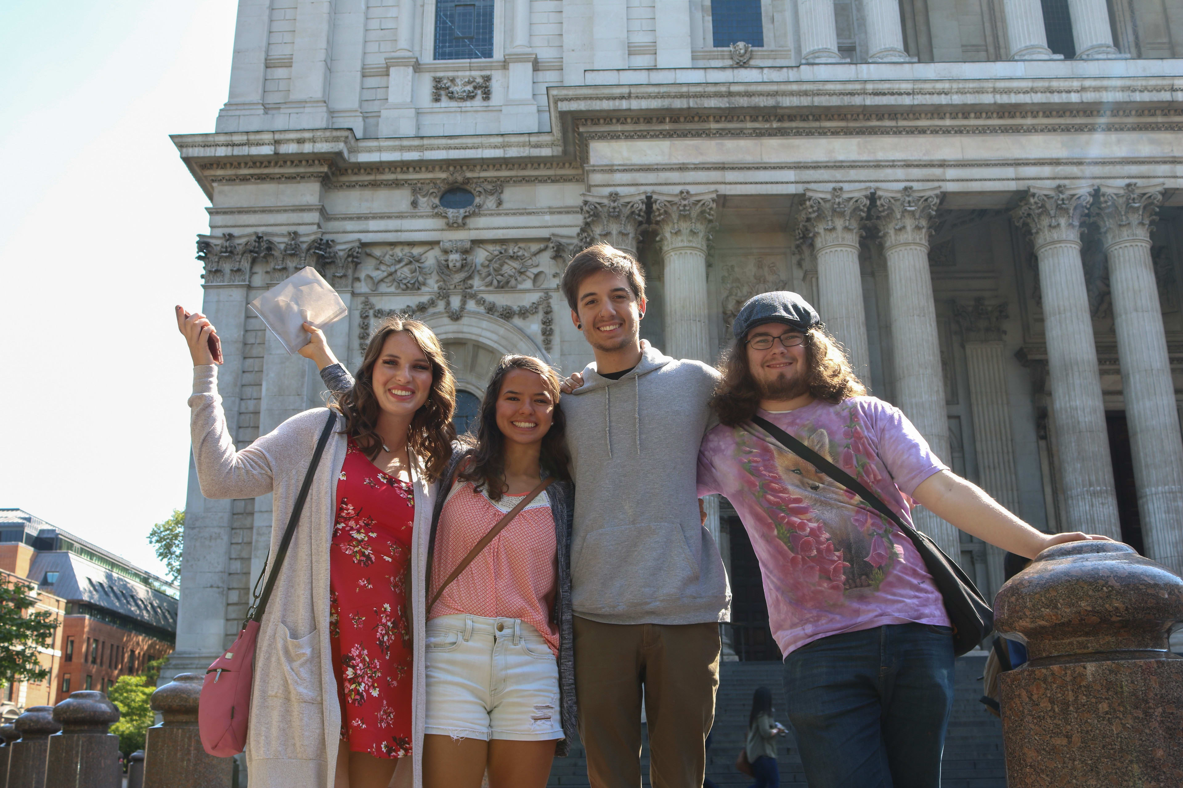 Students posing infant of an international building