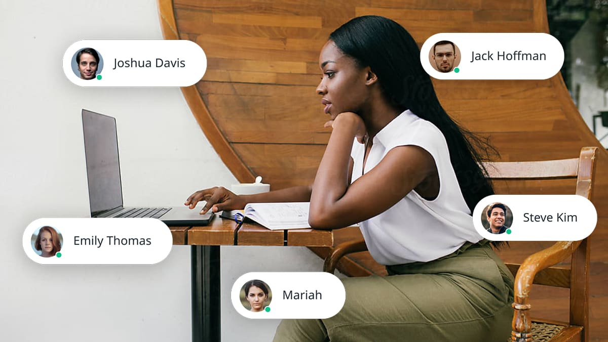 A woman interacting with the community on her laptop