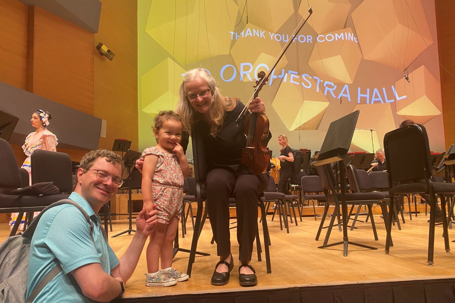Jean onstage at Orchestra Hall with son Daniel and granddaughter Eleanor.