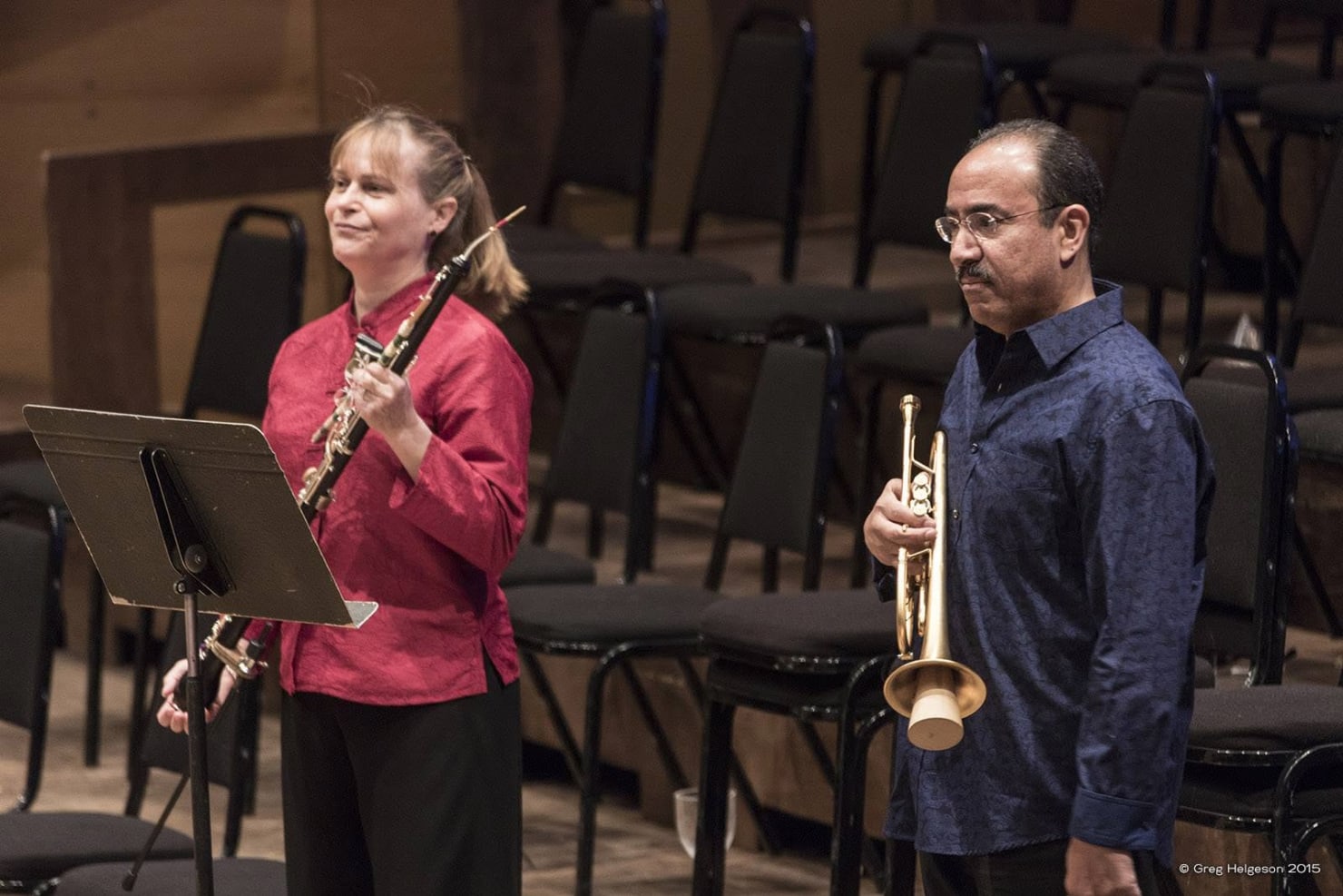 Marni J. Hougham and Principal Trumpet Manny Laureano accepting applause after a performance of Copland's Quiet City in 2015.