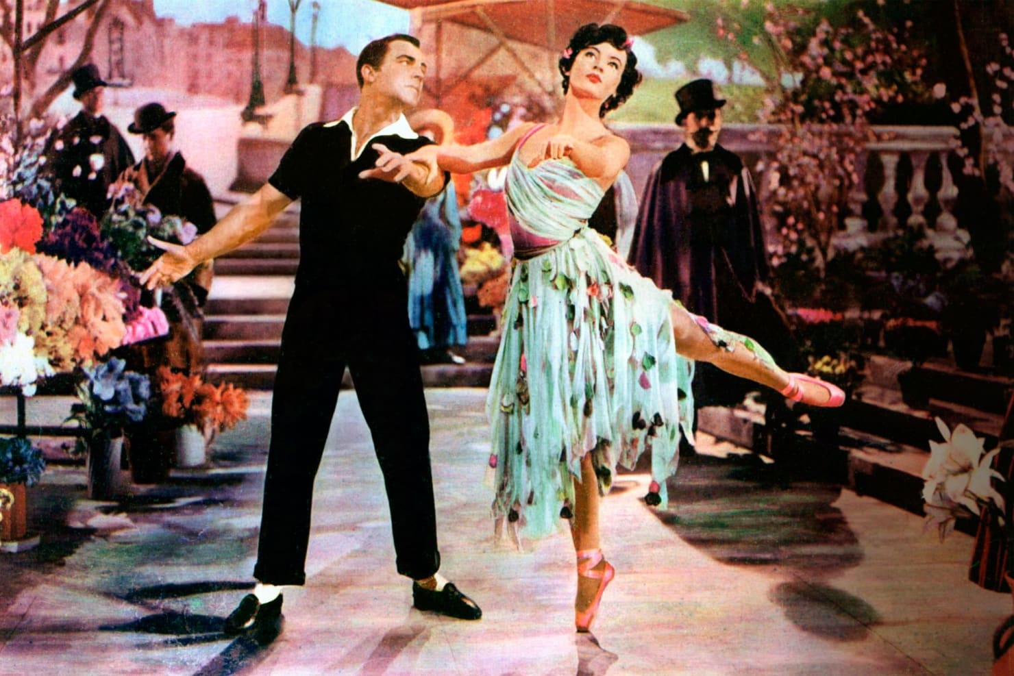 Two characters from "An American in Paris" dance in a highly-designed set.