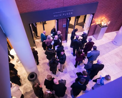 Patrons standing in line to have tickets scanned