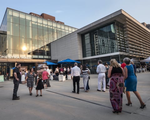 Patrons mingling outside during summer