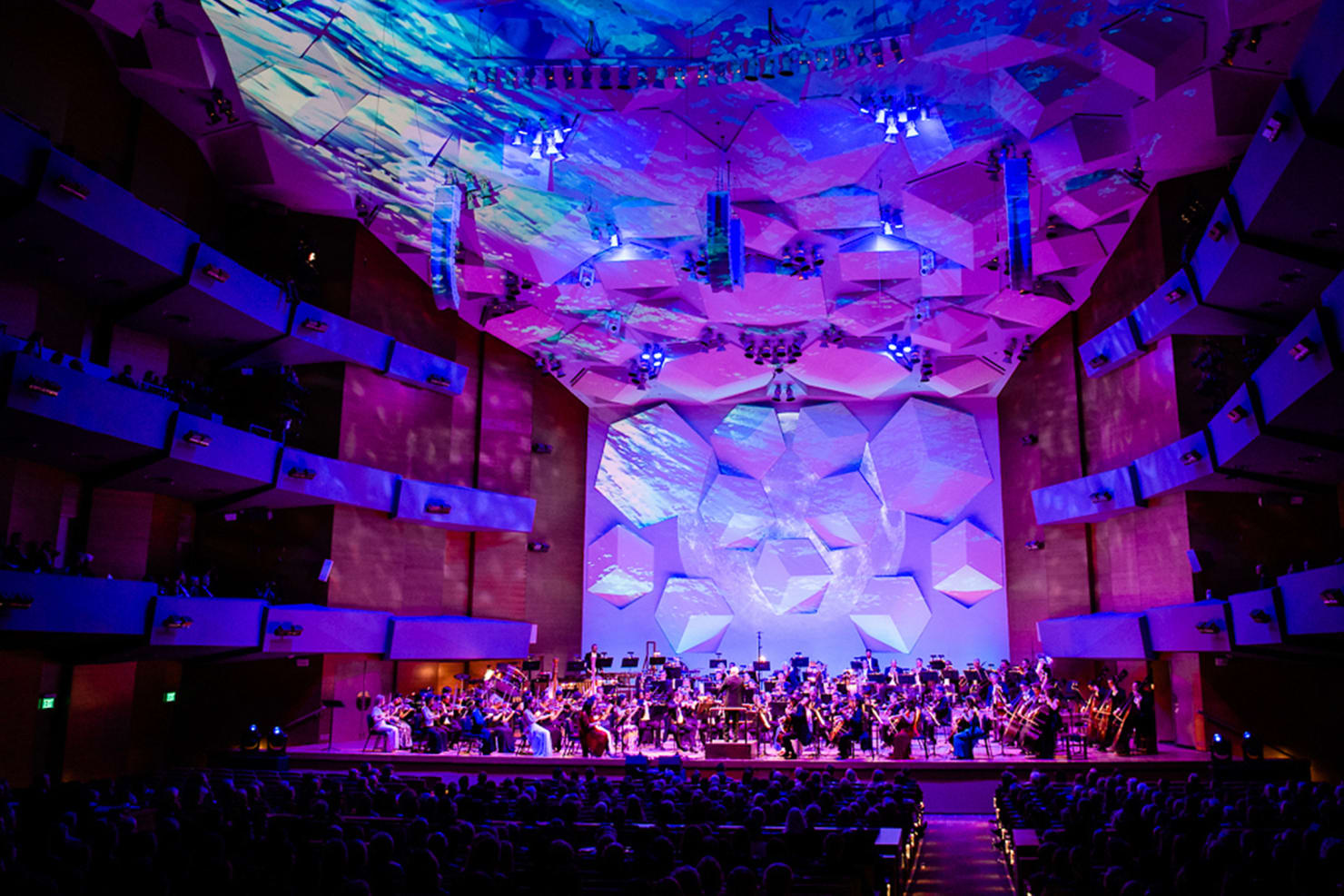 Performance at Orchestra Hall with purple and blue lighting