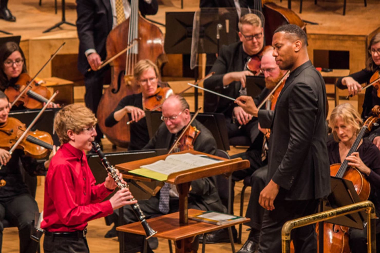 Student musician performing on stage