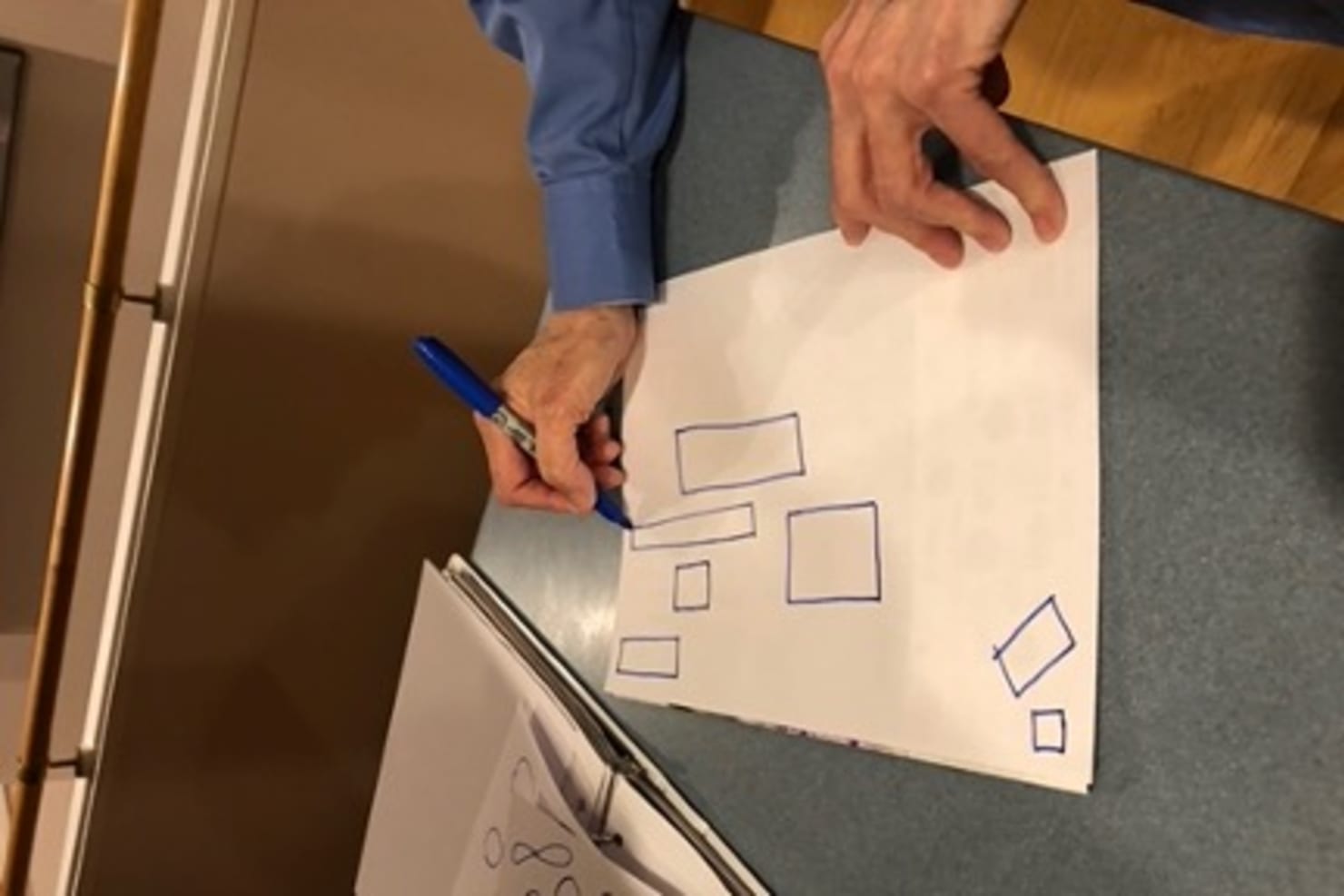 Person drawing rectangles