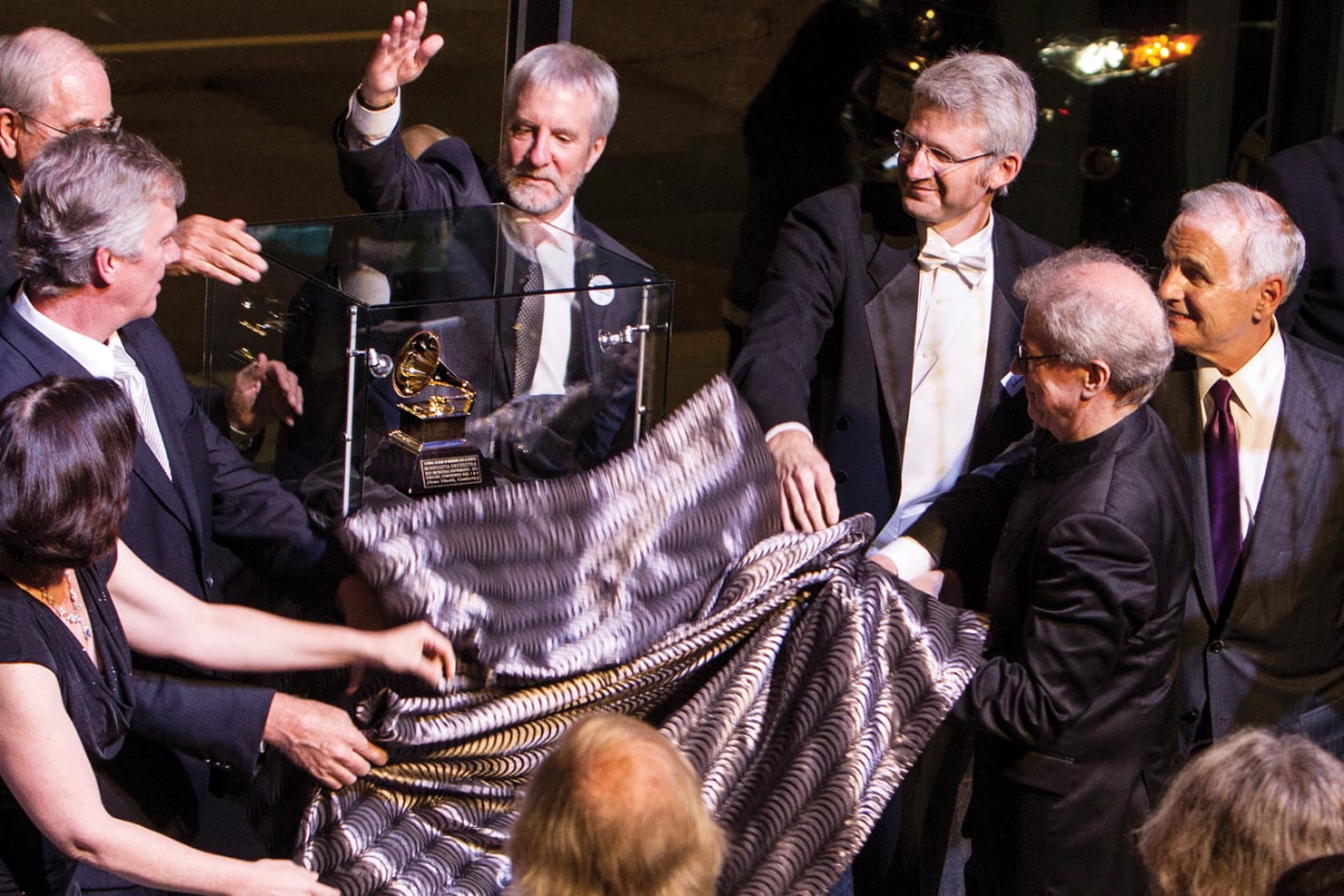 Orchestra board, staff, musicians reveal Grammy Award onstage at Orchestra Hall