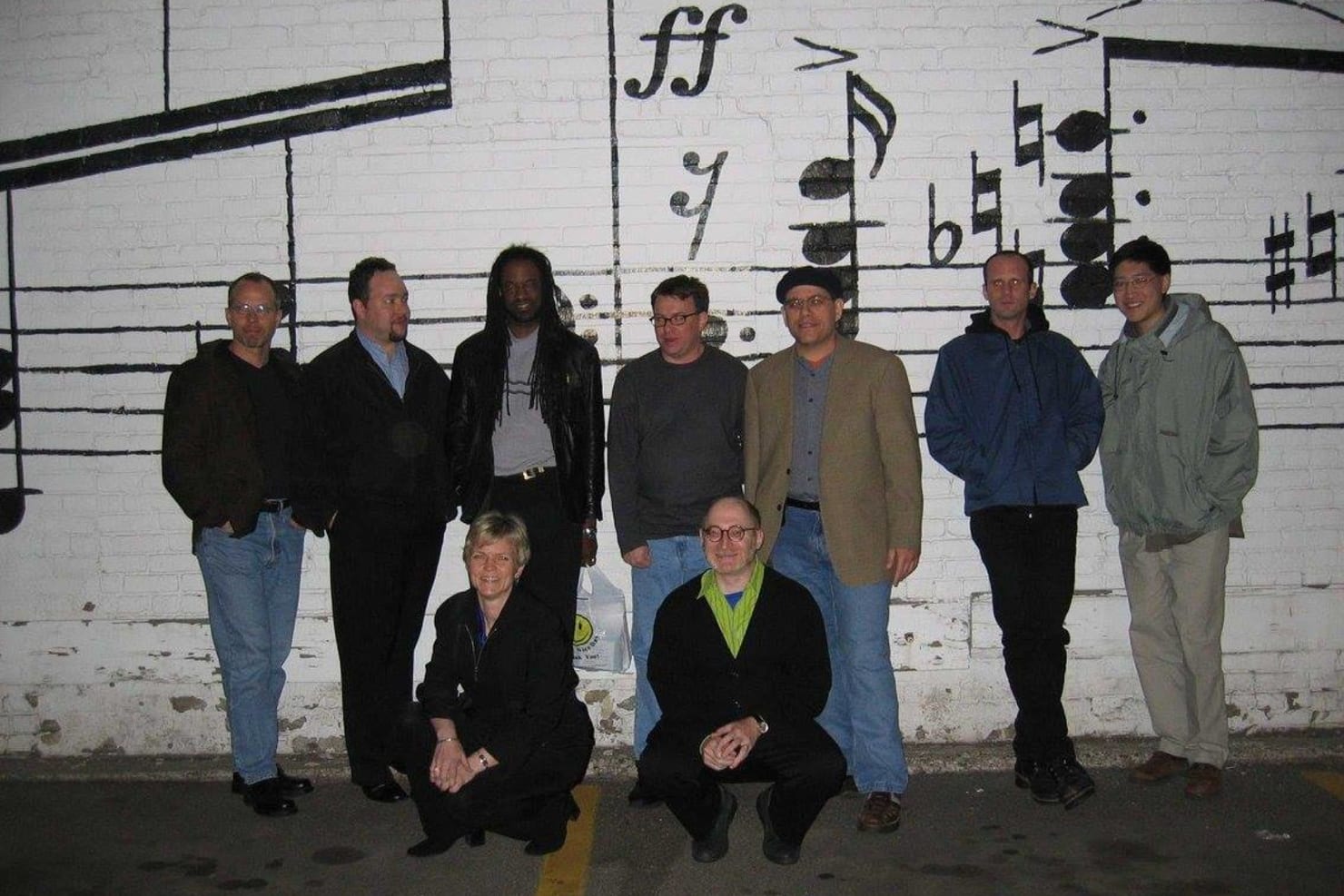 The third Minnesota Orchestra Composer Institute, held in May 2004, featured composers Anthony Cheung, Philip Fried, Michael Gatonska (the only two-time Institute participant), Gregory Hutter, Mark Koval, Robert Paterson and William A. Ware, seen here with Institute leaders Aaron Jay Kernis and Beth Cowart outside the Schmitt Music Building in downtown Minneapolis.