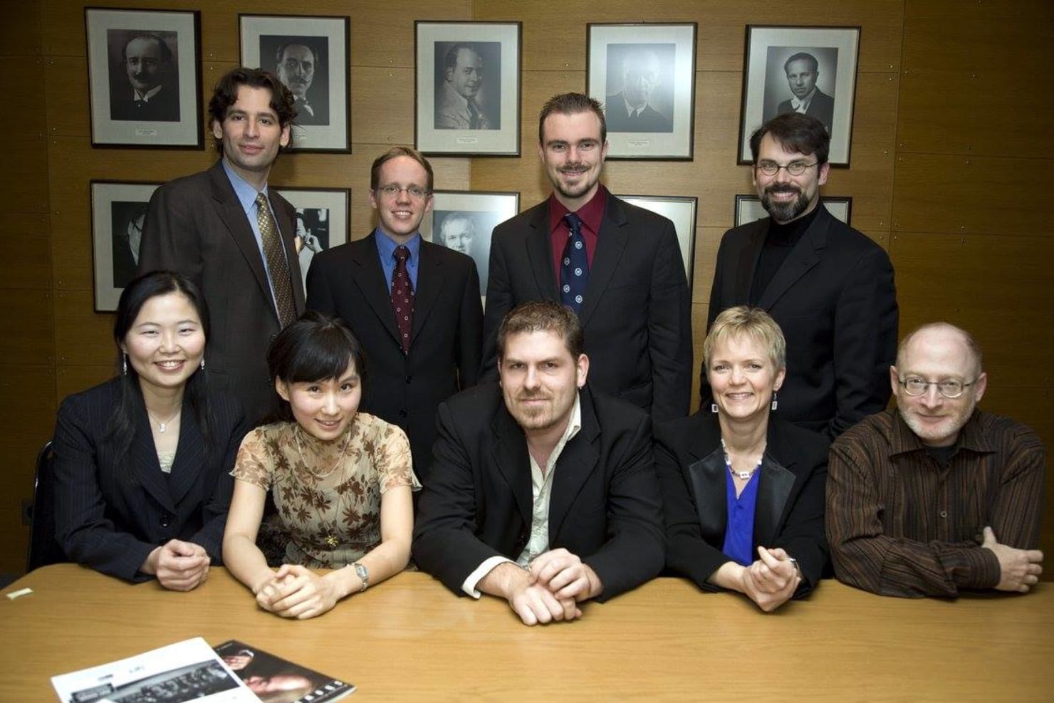 Held the week of election day 2008, the eighth Composer Institute featured composers Antonio Carlos DeFeo, Ted Hearne, Wang Lu, Andrew McManus, Justin Merritt, David Schneider and Ming-Hsiu Yen. They're seen here with Institute co-directors Aaron Jay Kernis and Beth Cowart, posing by portraits of the Minnesota Orchestra's ten music directors.