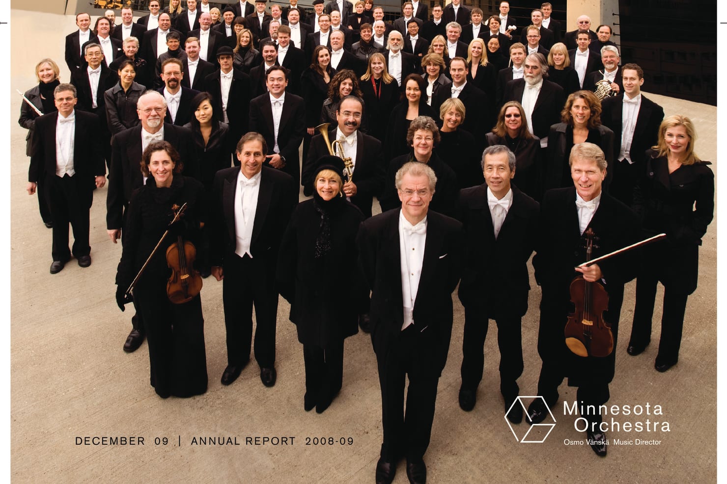 The Minnesota Orchestra and Osmo Vänskä atop a tall building in downtown Minneapolis.