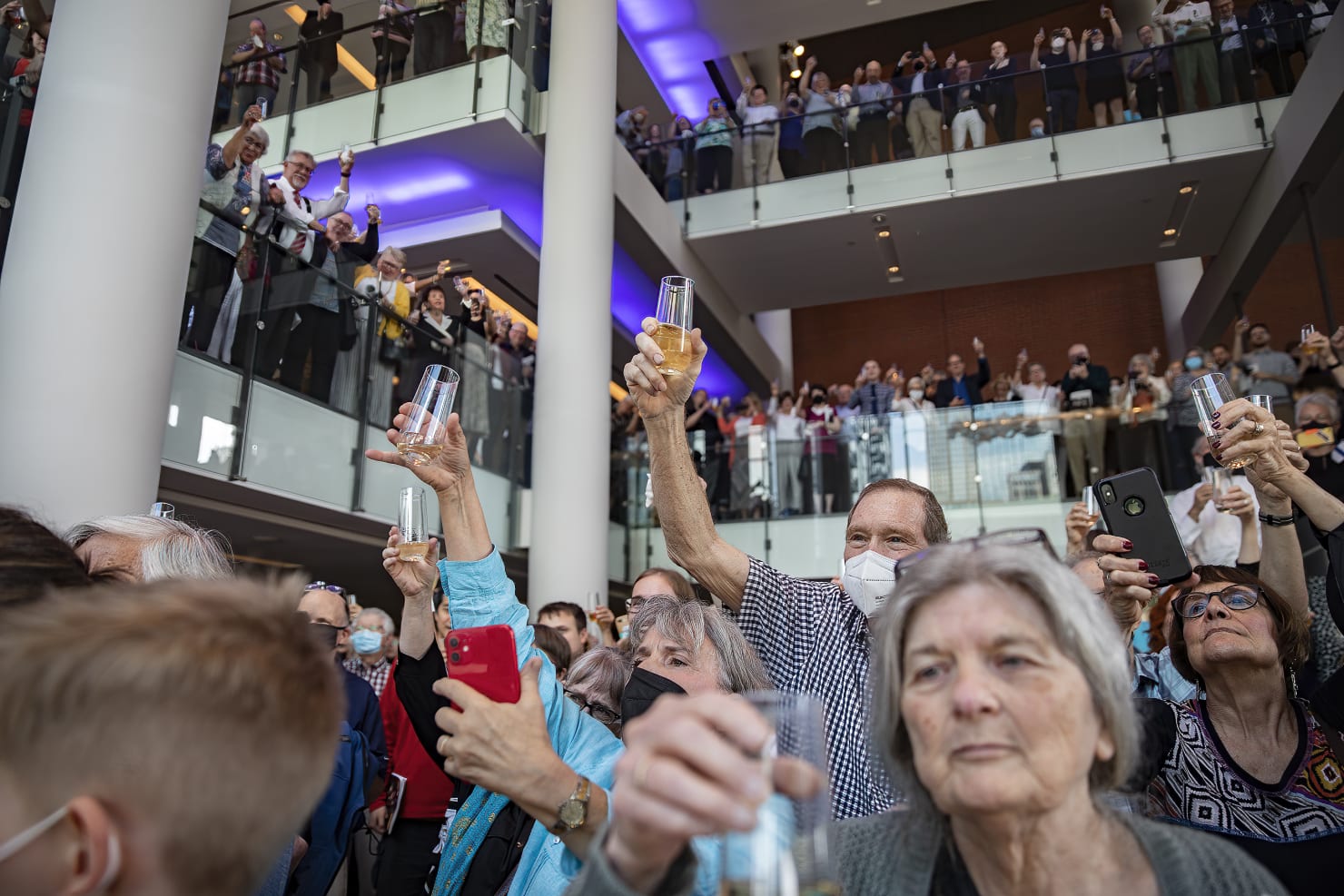 Audience members toast Osmo