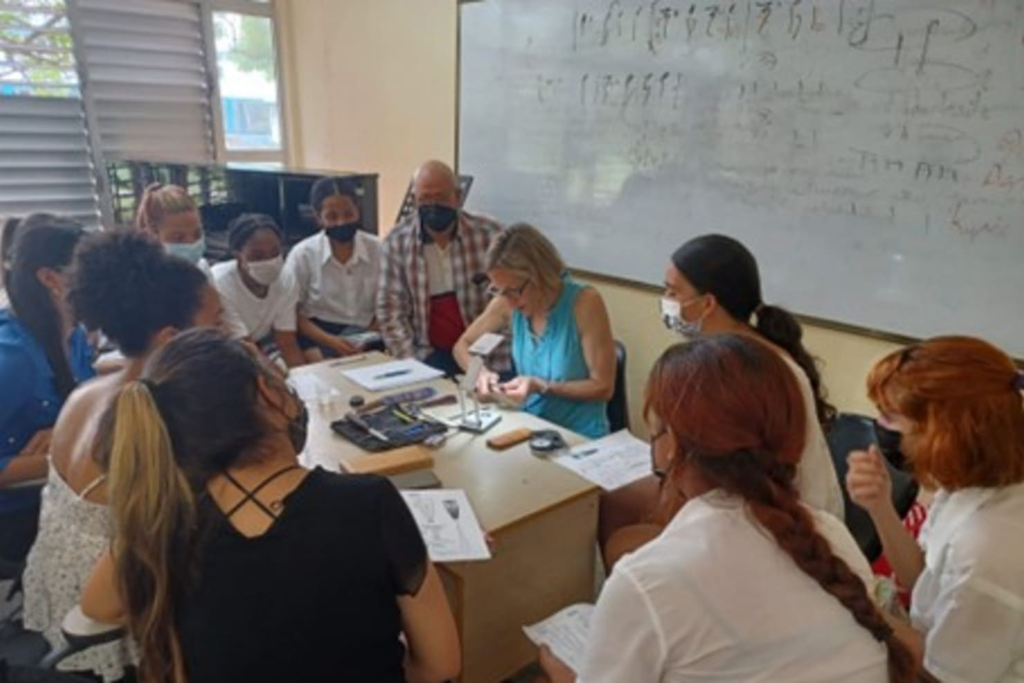 Minnesota Orchestra oboist Julie Gramolini Williams demonstrating reed-making techniques to students at Escuela Nacional de Arte in partnership with Cuban teacher and musician Lauren Rios.