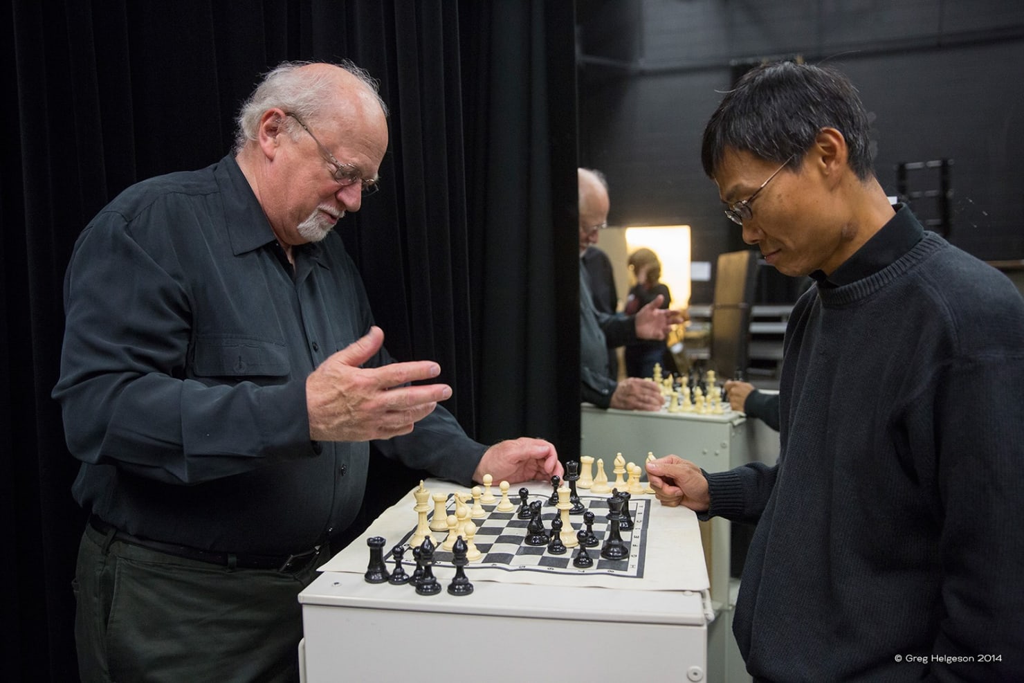 Taichi Chen and Robert Anderson playing chess backstage