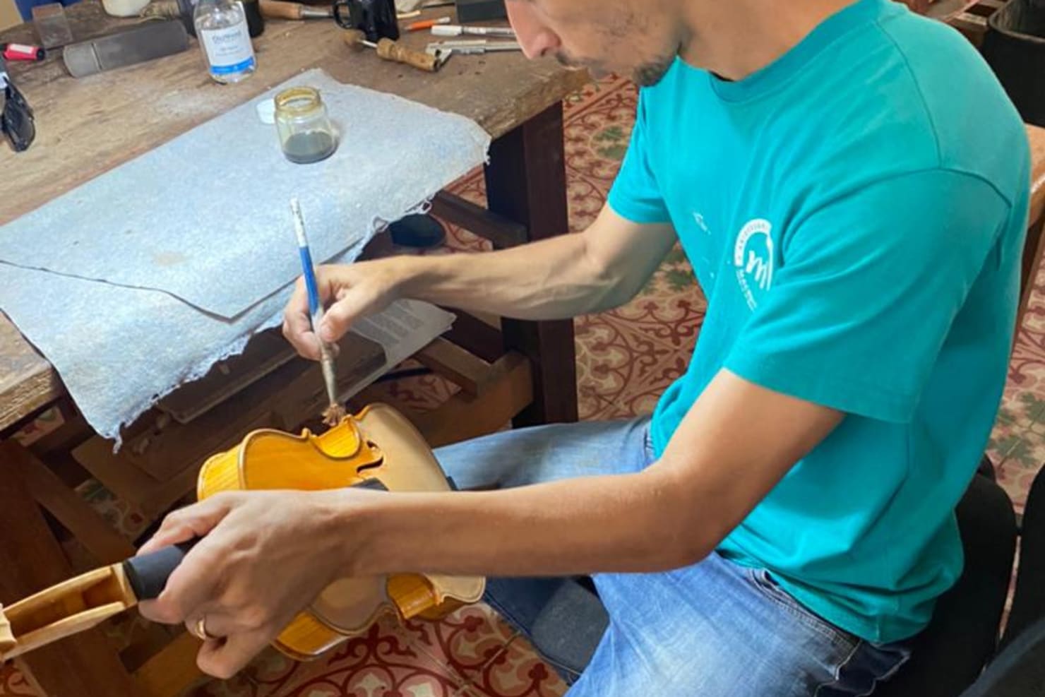 Cuban luthier Juan Carlos Prado Castro at work on a violin.