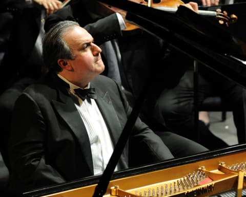 Pianist Yefim Bronfman sits at the grand piano
