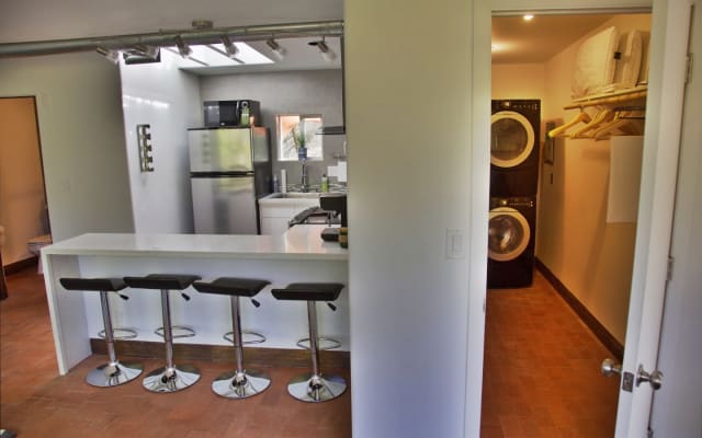 Alessandro's listing on misterb&b - The walk in closet includes a Washer and dryer and plenty of room to store clothing and luggage