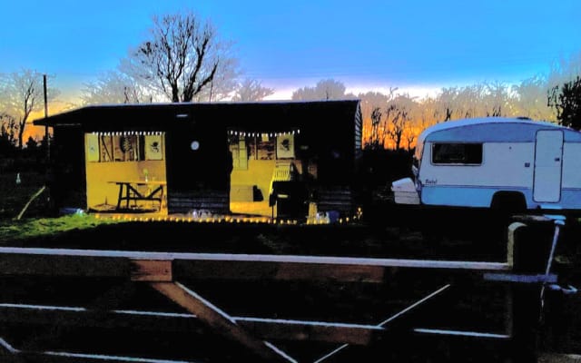 Vintage 2 berth caravan with adjoining covered leisure barn - off grid