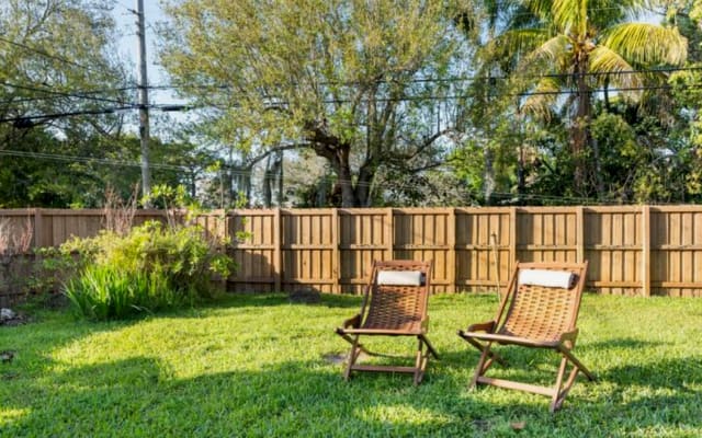 Dave's listing on misterb&b - large back yard and patio, completely fenced for privacy.  Freedom in the buff here too.
