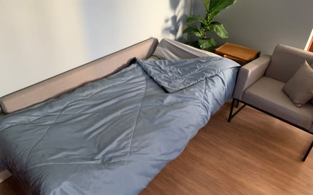 A comfy sofa bed in my cozy studio, close to metro station.