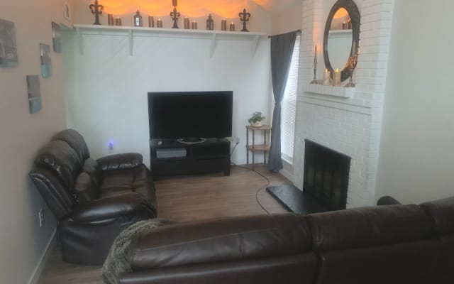 Wade's listing on misterb&b - Living room with two couches to lounge. Mood lighting at night. 