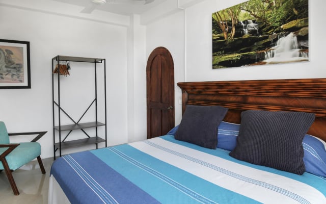 Camera privata con balcone vista baia a 5 de Diciembre