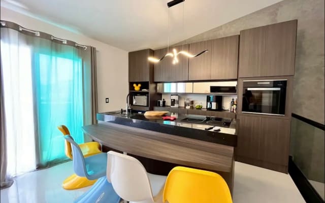 This is a penthouse two floors with two suite bedrooms. On the beach .