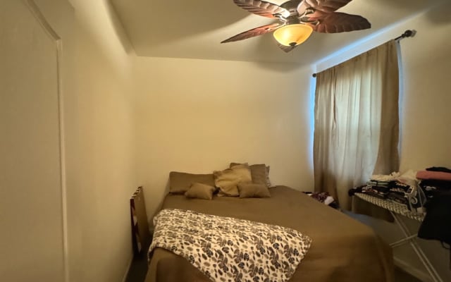 Spare bedroom next to home office, with private toilet shower and tub