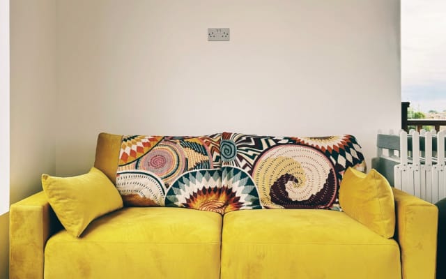 Sofa bed in shared room in clothing optional flat