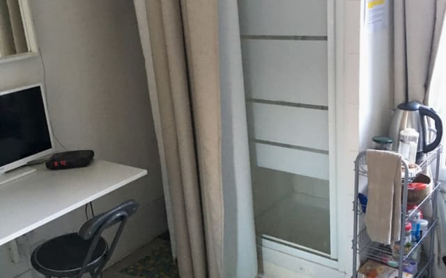 Very small studio, 5th floor, no elevator. No sink. Futon .