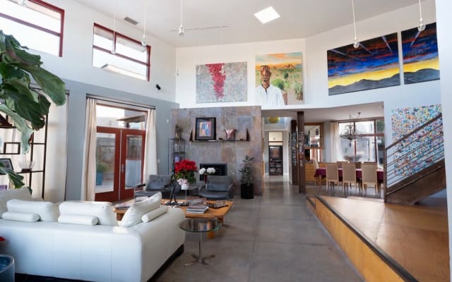 Neil's listing on misterb&b - Read or lounge in the spacious two story living room, surrounded by fine art. 