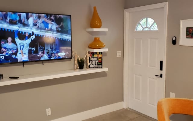 Chris and Patrick's listing on misterb&b - 65" TV in the Living Room