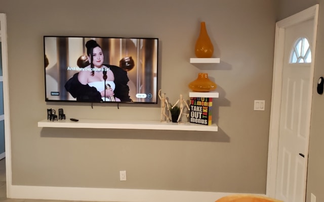 Chris and Patrick's listing on misterb&b - 65" Roku TV in the Living Room