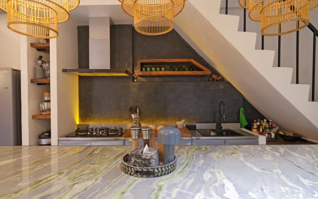 Mihael's listing on misterb&b - 【Kitchen】Premium appliances (oven, mixer, rice cooker), stainless steel surfaces, and gourmet spices. Central dining table seats 6.