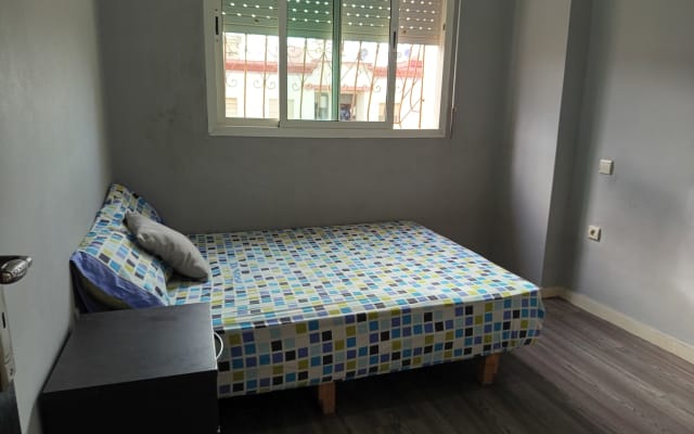 Single room in secure apartment with garden, quiet, green setting.