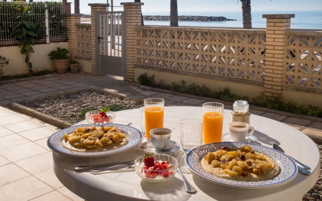 Isabel's listing on misterb&b - Private veranda/garden at the very beach front. What's better than having breakfast with a view? (we don't provide meals, but a complete kitchen).