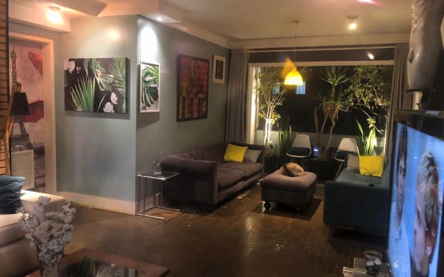 Sergio's listing on misterb&b - TV room, living room and balcony integration.