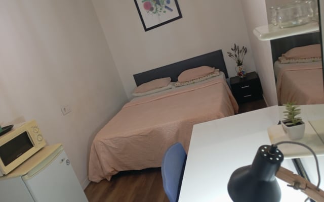 ROOM...WITH A DOUBLE BED, REFRIGERATOR, and MICROWAVE, air...