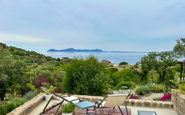 A stunning house and gardens between the sea and the volcano on...