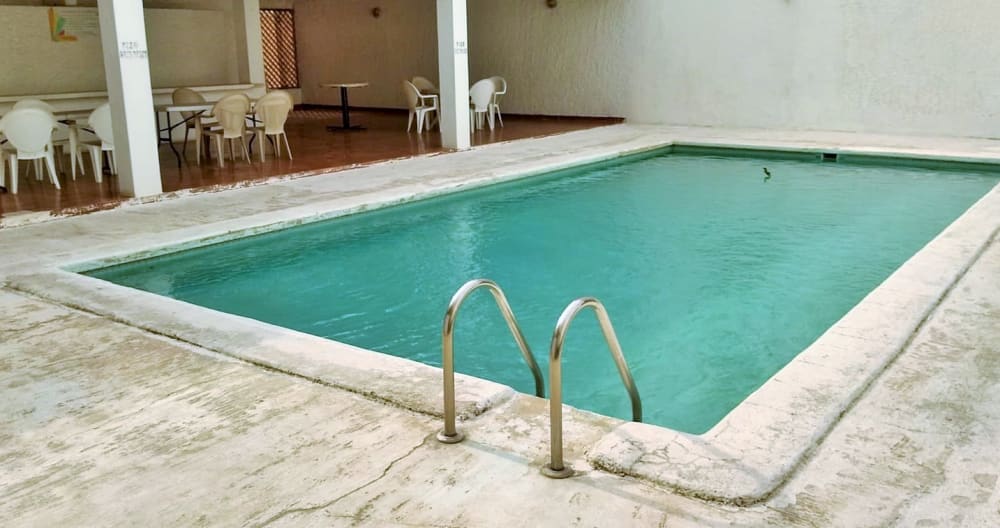 Comfortable bedroom in condo with pool. - Picture 10