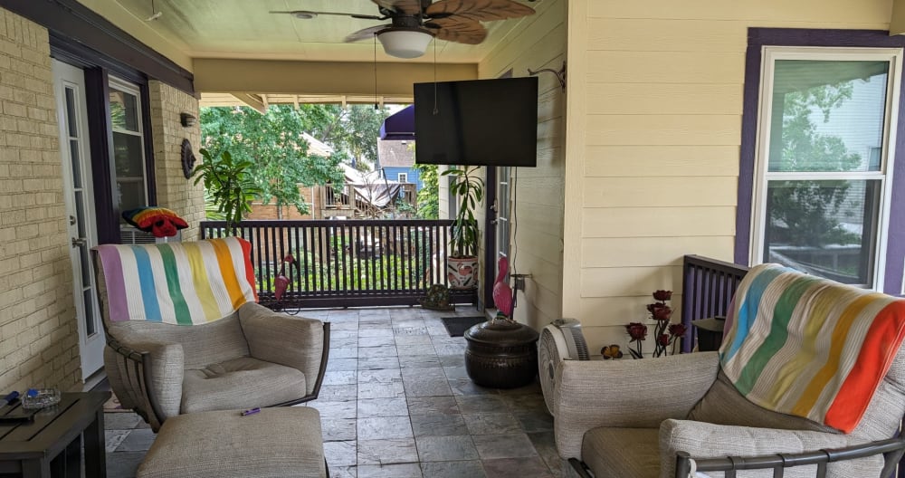 Jeffrey's listing on misterb&b - Shared space, the Back Deck/Breezeway. This is top of stairs, and unit door is behind TV in this pic.