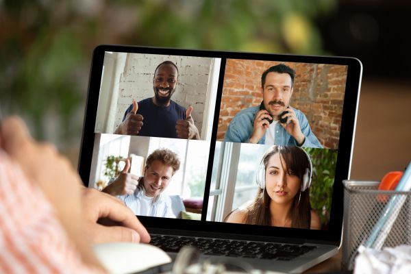 A video call of a Scrum between five people, on a laptop.