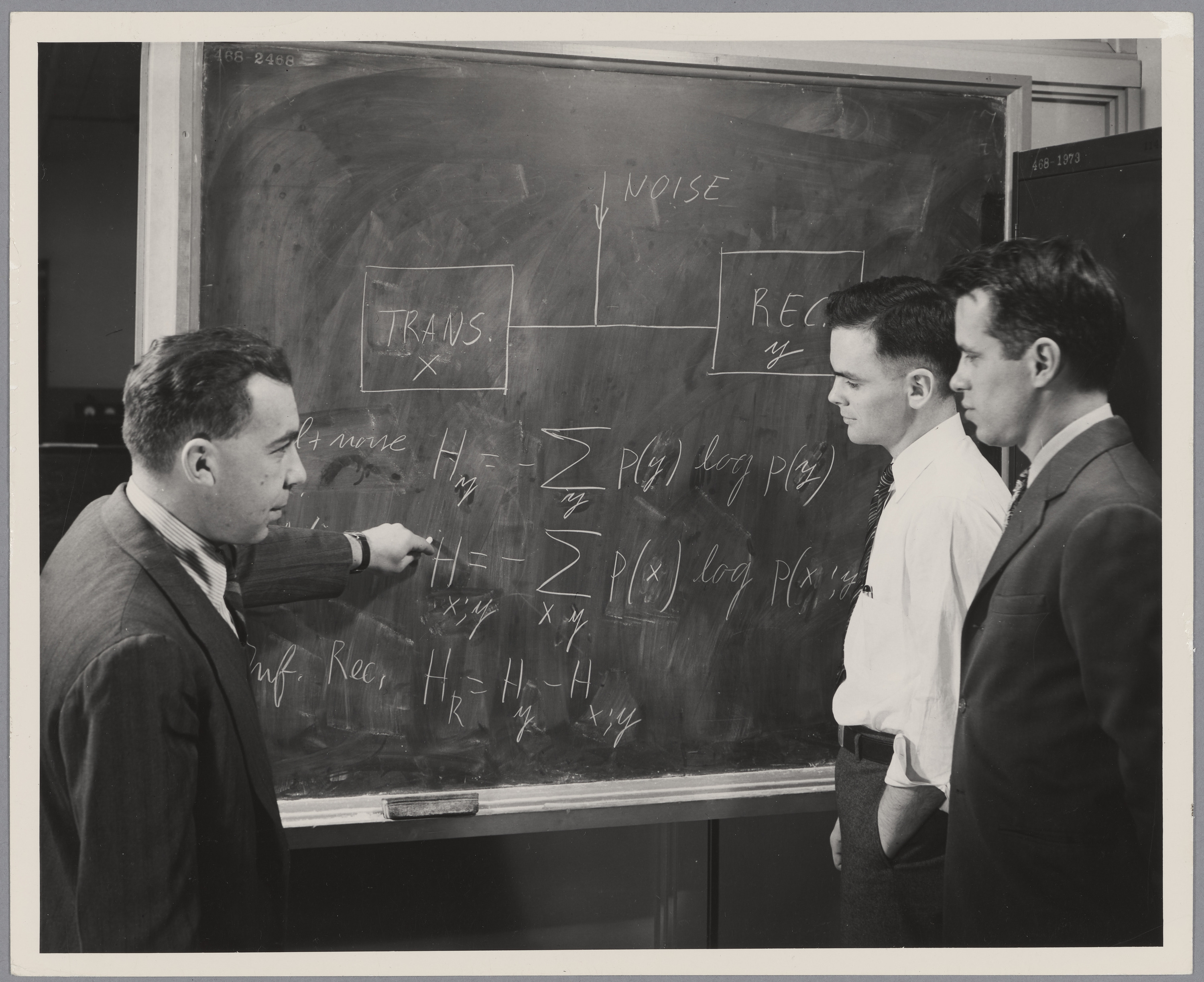Robert Mario Fano Leon G. Kraft Jr and Wilbur B. Davenport Jr. working at blackboard 1949 MIT Museum