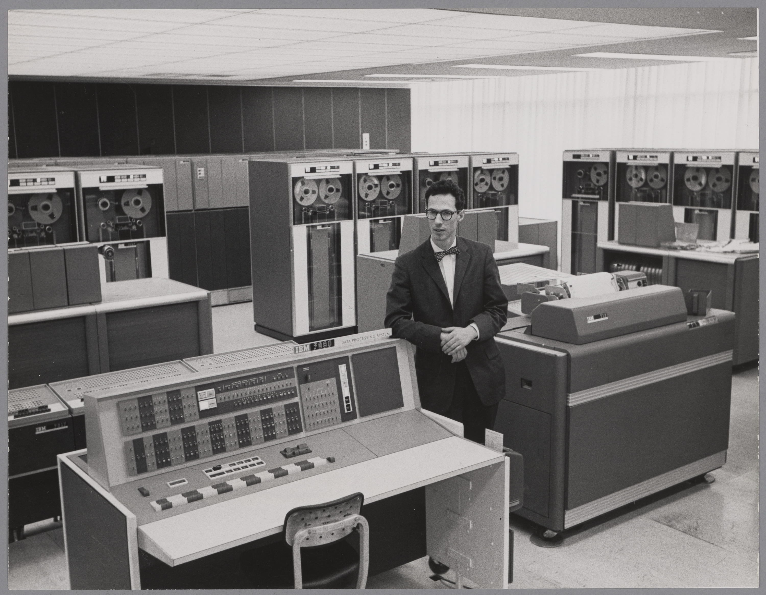 Fernando J. Corbató with IBM 7090 computer console in the