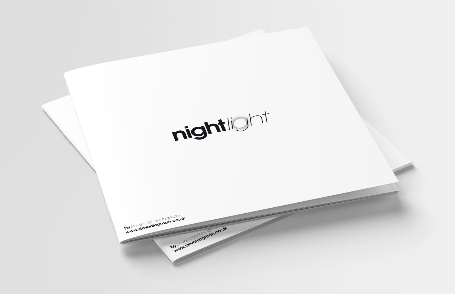 front cover beauty shot of night light catalogue depicting black logo on white paper