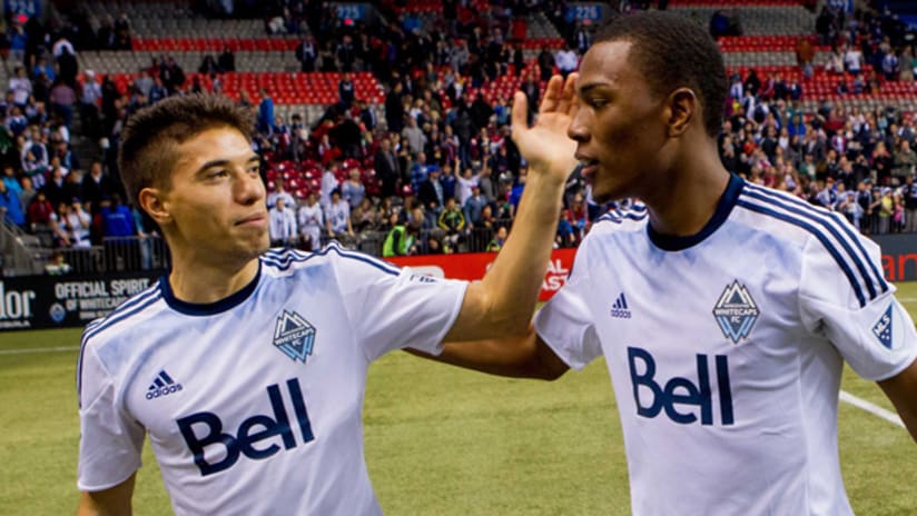 Nicolas Mezquida and Deybi Flores celebrate a Vancouver Whitecaps win