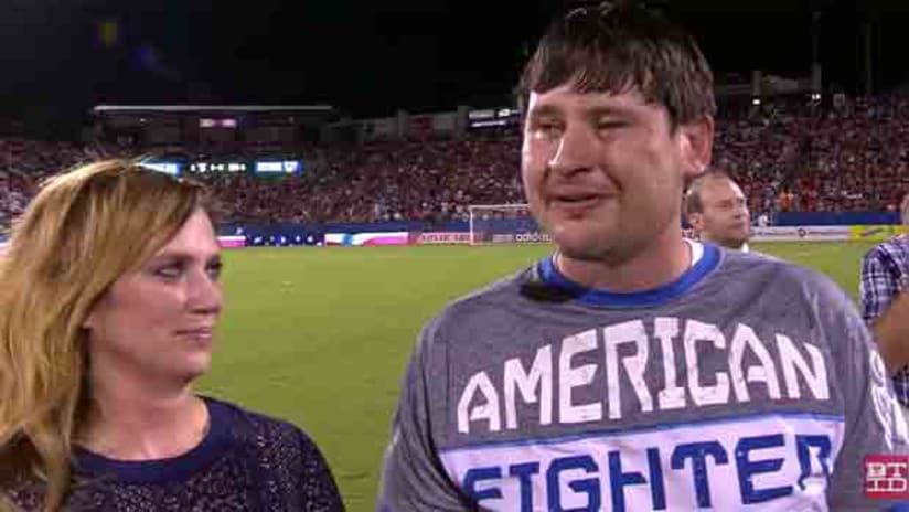 US veteran Jerry Holcomb and his wife accept a new home on July 4