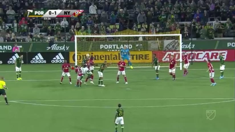 SHOT: Claude Dielna sends a header just wide