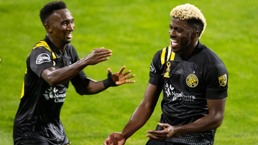 Gyasi Zardes - Columbus Crew - celebrates a goal with Harrison Afful