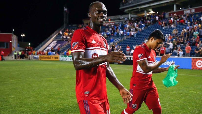 Micheal Azira - Chicago Fire - walks off the field - smiling