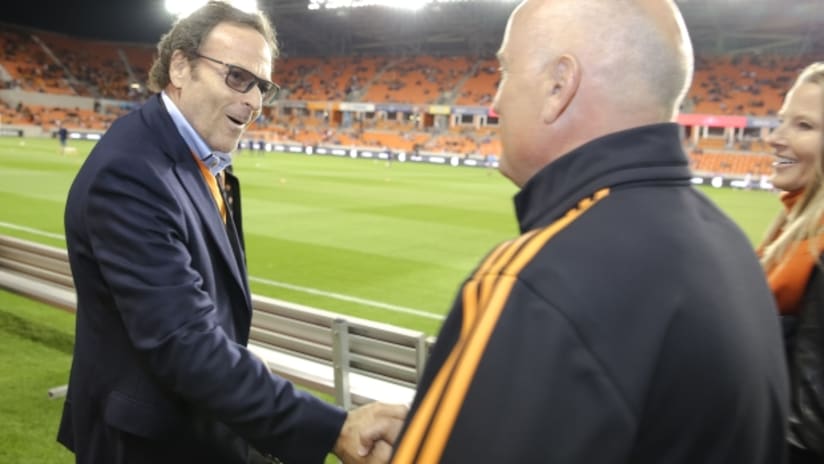 Houston Dynamo equity partner Gabriel Brener greets head coach Dominic Kinnear